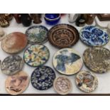 A QUANTITY OF LARGE STUDIO POTTERY PLATES TO INCLUDE FISH DESIGN, FLORAL, AZTEC, ETC