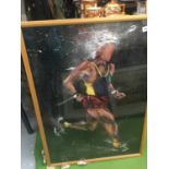 A LARGE FRAMED PRINT OF A RUNNER BY TOP ON LINE ARTIST TERRY ROSE