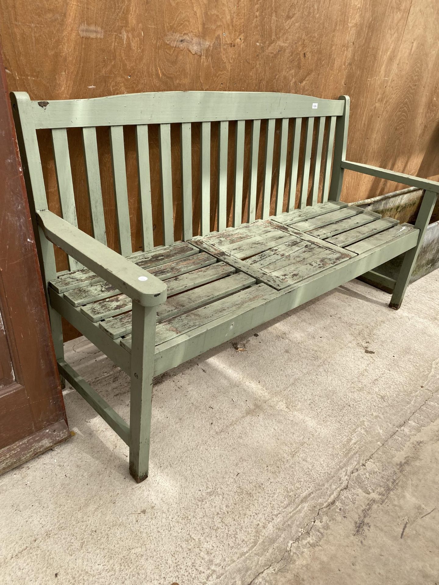 A WOODEN SLATTED GARDEN BENCH - Image 2 of 3