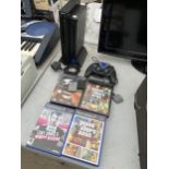A SONY PLAYSTATION 2 WITH GAMES