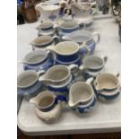 A QUANTITY OF BLUE AND WHITE JUGS TO INCLUDE JASPERWARE STYLE