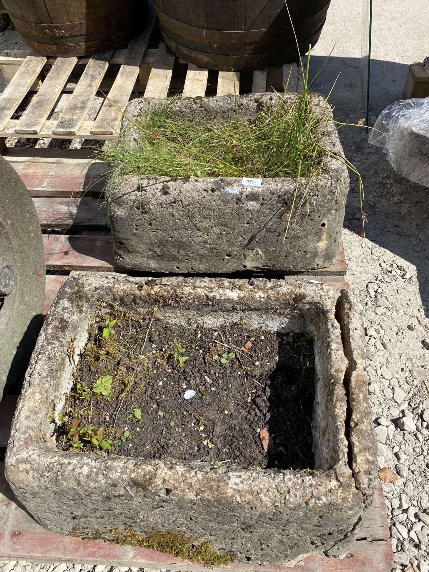 A PAIR OF RECONSTITUTED STONE TROUGH PLANTERS (ONE A/F)