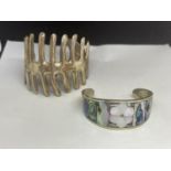 TWO SILVER BANGLES TO INCLUDE A MOTHER OF PEARL STYLE AND A FISHBONE DESIGN
