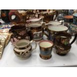 A QUANTITY OF LUSTREWARE JUGS WITH FLORAL AND PASTORAL DECORATION