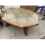 A MODERN OAK OCTAGONAL FRAMED COFFEE TABLE WITH TILED TOP, 42" ACROSS