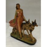 AN EARLY 20TH CENTURY ART DECO STYLE CHALKWARE FIGURE OF A LADY AND TWO GERMAN SHEPHERDS MARKED RD