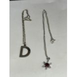 TWO SILVER NECKLACES ONE WITH A STAR PENDANT AND ONE WITH A D