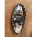 A DECORATIVE FRAMED WALL MIRROR