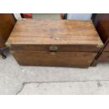 A 19TH CENTURY MAHOGANY TRUNK WITH MILITARY STYLE BRASS HANDLES AND STRAPS