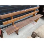 A PITCH PINE BENCH, 83" WIDE WITH BACK