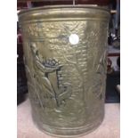 A VINTAGE BRASS WASTE BIN WITH EMBOSSED TAVERN SCENE HEIGHT 28.5CM