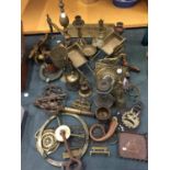 A LARGE QUANTITY OF BRASSWARE TO INCLUDE CANDLESTICKS, TELESCOPE, BELLS, CLOCK, ETC