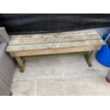 A SMALL WOODEN GARDEN BENCH