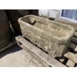 A RECONSTITUTED STONE TROUGH PLANTER