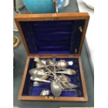A MAHOGANY BOX CONTAINING A QUANTITY OF VINTAGE FORKS AND SPOONS