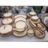 A LARGE QUANTITY OF ROYAL ALBERT DINNERWARE IN A CREAM COLOUR WITH BURGUNDY AND GILT EDGES AND