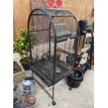 A LARGE FOUR WHEELED PARROT CAGE
