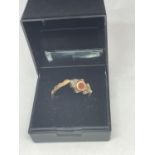 A YELLOW METAL SWIVEL RING SIZE Q IN A PRESENTATION BOX