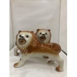 A PAIR OF VINTAGE STAFFORDSHIRE LIONS WITH GLASS EYES, HEIGHT 26CM, LENGTH 34CM