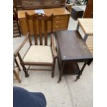 AN OAK ELBOW CHAIR AND TROLLEY