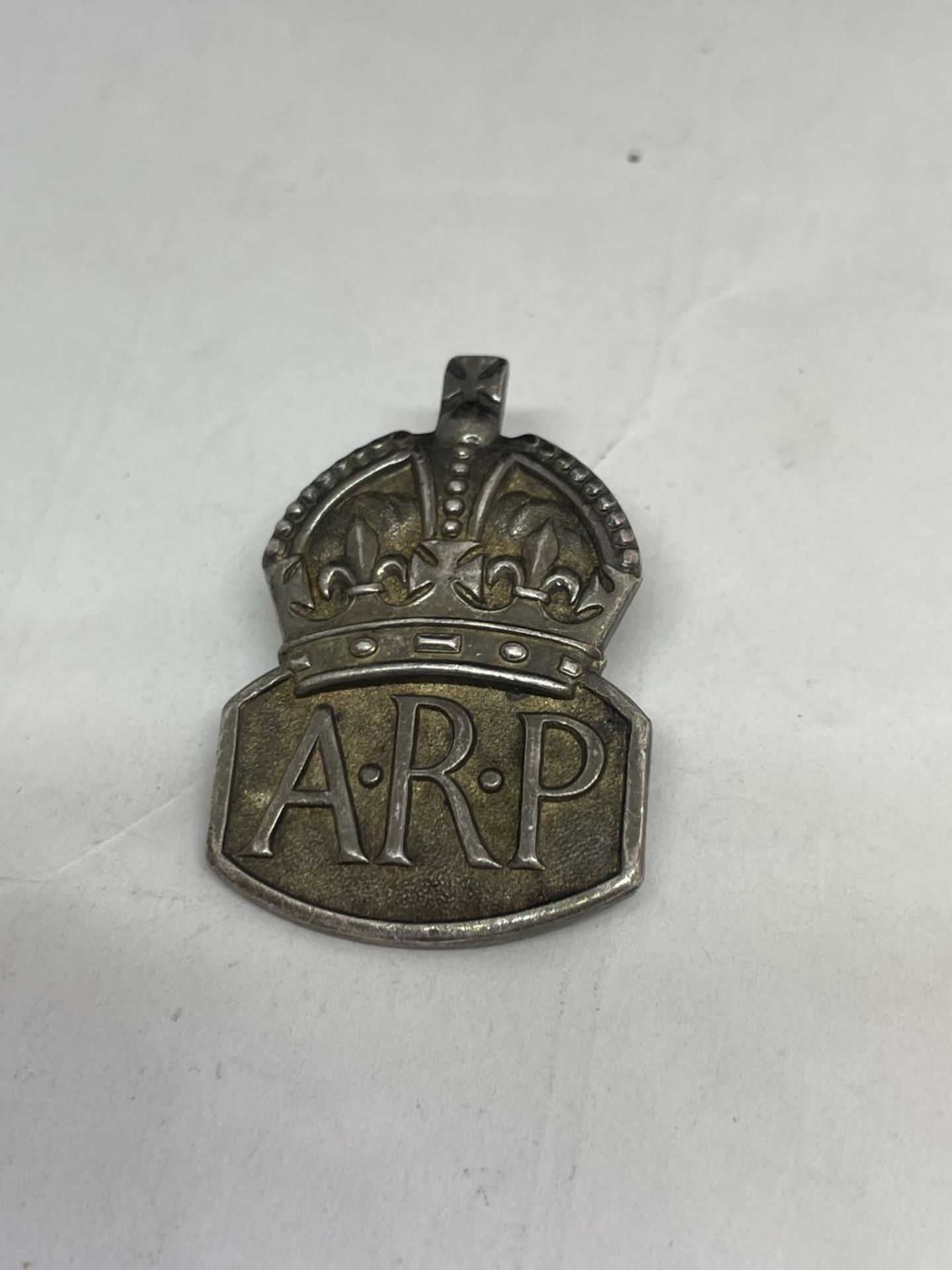 A SILVER WW2 A.R.P. BADGE