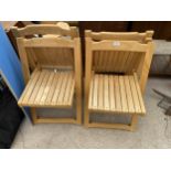 A SET OF FOUR WOODEN FOLDING CHAIRS
