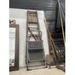 A VINTAGE FIVE RUNG WOODEN STEP LADDER AND AND A SMALL TWO RUNBG STEP