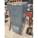 A METAL FOUR DRAWER FILING CABINET