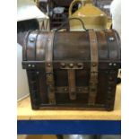 A WOODEN DOMED TOP BOX WITH LEATHER STRAPS HEIGHT 26CM, WIDTH 28CM, DEPTH 20CM