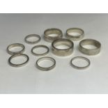 TEN WHITE METAL RINGS TESTED AS SILVER