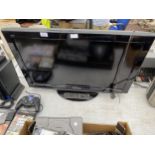 A PANASONIC 32" TELEVISION WITH REMOTE CONTROL