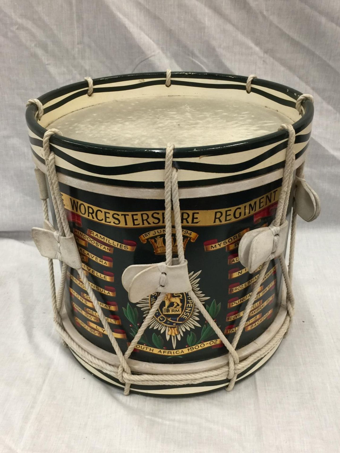 A MARCHING BAND DRUM WITH WORCESTERSHIRE REGIMENT SOUTH AFRICA 1900 - 02 DECORATION