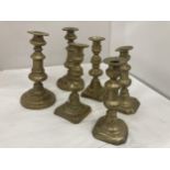 THREE PAIRS OF GRADUATED BRASS CANDLESTICKS, HEIGHTS, 22CM, 20CM AND 19CM