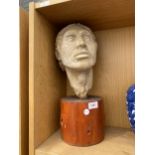 A RESIN MALE BUST ON A WOODEN PLINTH BASE