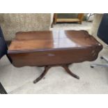 A MAHOGANY SHAPED TOP DROP-LEAF COFFEE TABBLE ON QUATREFOIL BASE, 36X23" OPENED