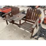 A WOODEN SLATTED GARDEN SEAT WITH CENTRE TABLE