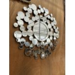 A DECORATIVE WALL MIRROR