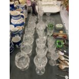 A QUANTITY OF GLASSES TO INCLUDE BRANDY, WINE, SHERRY, CHAMPAGNE FLUTES PLUS A HOBNAIL DECANTER,