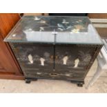 A MODERN CHINOISERIE CABINET WITH TWO DOORS, SINGLE DRAWER AND GLASS TOP, 24" WIDE