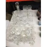 A QUANTITY OF GLASSWARE TO INCLUDE A CUT GLASS DECANTER, WINE GLASSES, CHAMPAGNE FLUTES, SHERRY