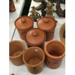 SIX TERRACOTTA STORAGE CANNISTERS