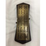 A VINTAGE BRASS CRIBBAGE BOARD