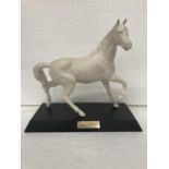 A BESWICK WHITE MATT HORSE ON WOODEN PLINTH "SPIRIT OF THE WIND" - FROM HOOF TO TOP OF EAR - 22 CM