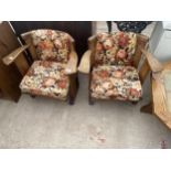 A PAIR OF LOW BEECH MID 20TH CENTURY CHAIR WITH WIDE ARM RESTS