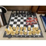 A LARGE FLOOR CHESS SET