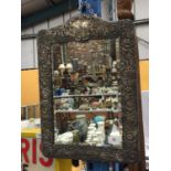 AN ORNATELY DECORATED WALL HANGING MIRROR WITH POSSIBLY SILVER FRAME H: 52CM