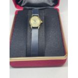 A 9 CARAT GOLD SOVEREIGN WRIST WATCH IN A PRESENTATION BOX