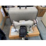 A RETRO BROTHER SEWING MACHINE WITH CARRY CASE AND FOOT PEDAL