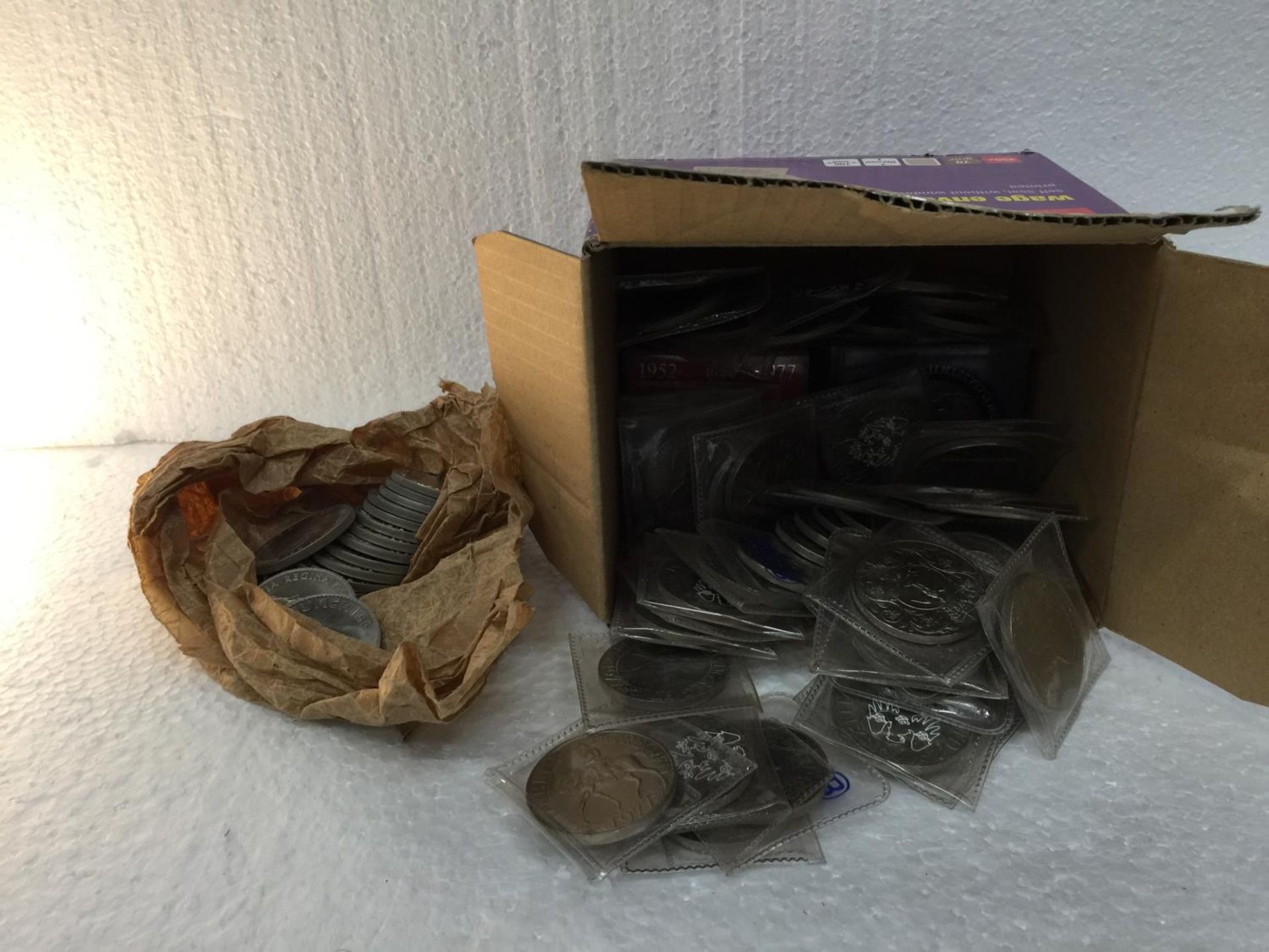 A BOX CONTAINING 79 UNCIRCULATED QEII CROWN COINS