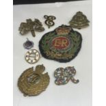 A BAG OF VARIOUS ARMY BADGES